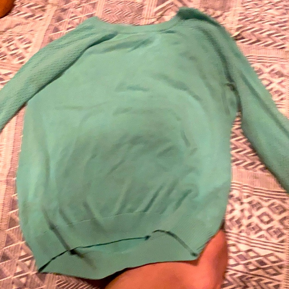 Aqua green sweater with sleeves with small holes